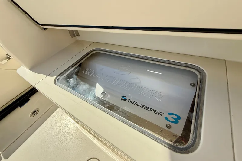 Slide: The Image of Seakeeper 3 stabilizer on 2019 Scout 355 LXF boat, enhancing stability and comfort. - 34