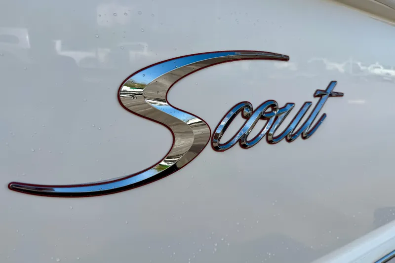 Slide: The Image of Scout 355 LXF 2019 logo on boat exterior with water droplets. - 38