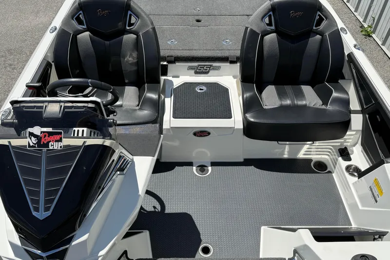 Slide: The Image of 2023 Ranger Z520C Cup-Equipped boat interior with black seats and steering console. - 17