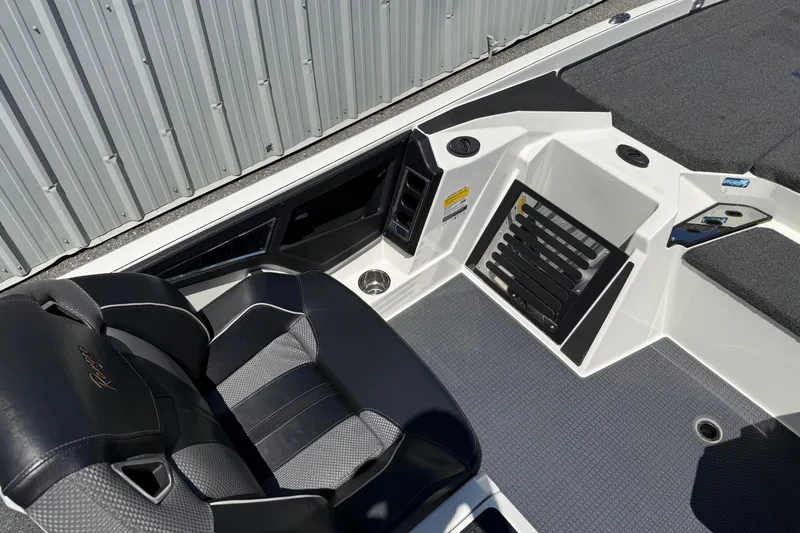 Slide: The Image of 2023 Ranger Z520C Cup-Equipped boat interior with black seat and storage compartments. - 20
