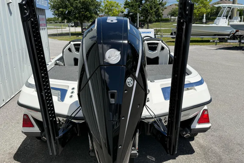 Slide: The Image of 2023 Ranger Z520C Cup-Equipped boat with powerful outboard motor, parked outdoors. - 6