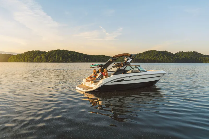 Slide: The Image of 2026 Sea Ray SDX 230 Surf on calm lake at sunset. - 13