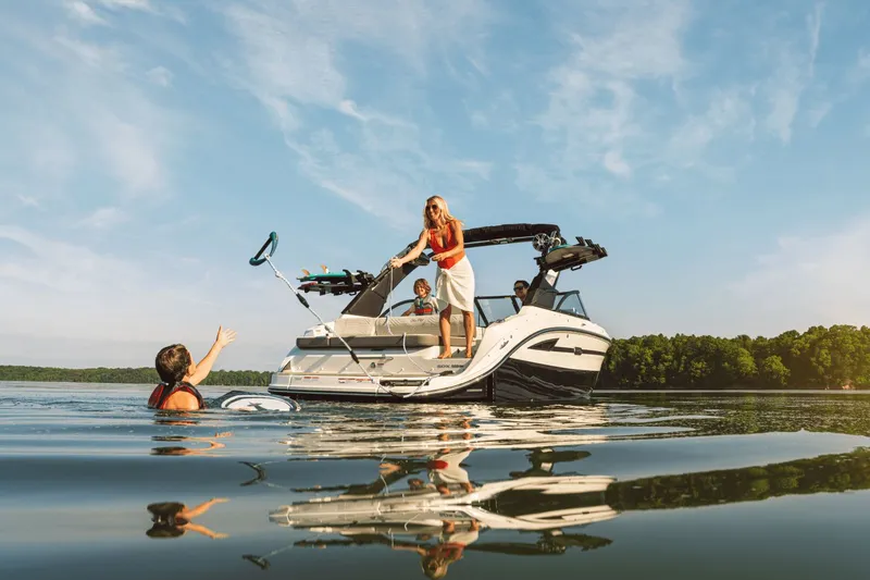 Slide: The Image of 2026 Sea Ray SDX 230 Surf on a tranquil lake. - 14