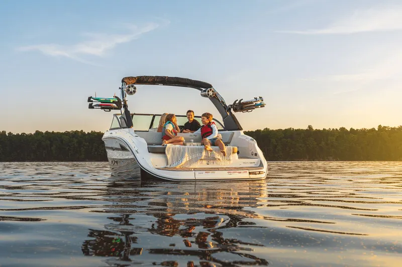 Slide: The Image of Family enjoying sunset on Sea Ray SDX 230 Surf 2026. - 2