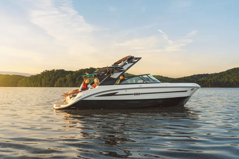 Slide: The Image of 2026 Sea Ray SDX 230 Surf on a tranquil lake at sunset. - 37