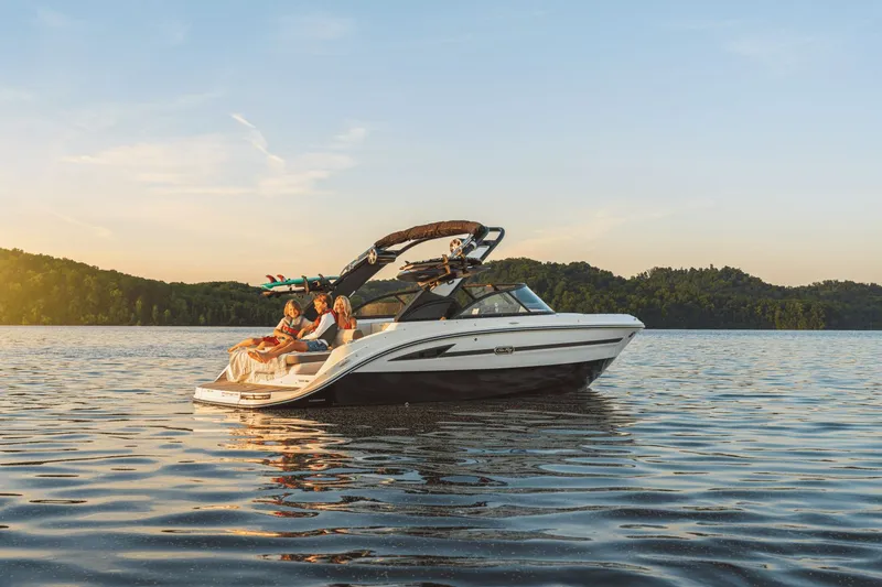Slide: The Image of Sea Ray SDX 230 Surf 2026 on a tranquil lake at sunset. - 38