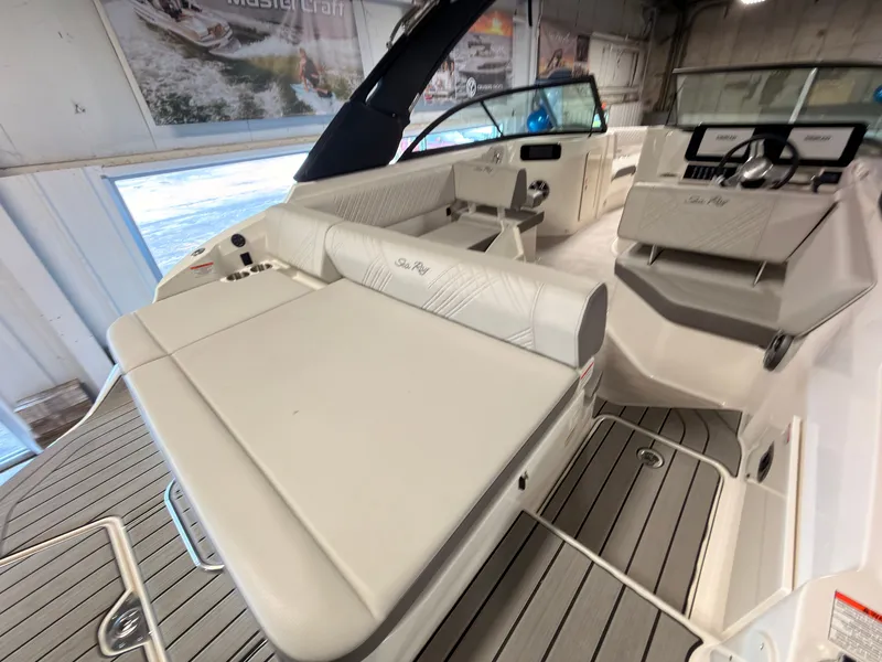 Slide: The Image of The image shows the interior of a 2026 Sea Ray SDX 230 Surf boat with sleek seating and modern features. - 14