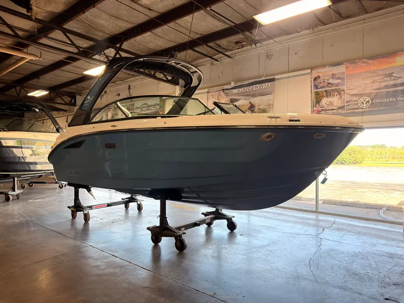 Slide: The Image of A 2026 Sea Ray SDX 230 Surf is on a dolly in a warehouse. - 1