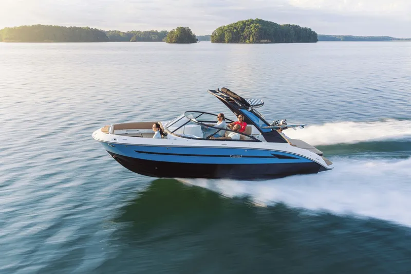 The Image of 2026 Sea Ray SDX 250 Surf boat cruising on calm waters. - 0