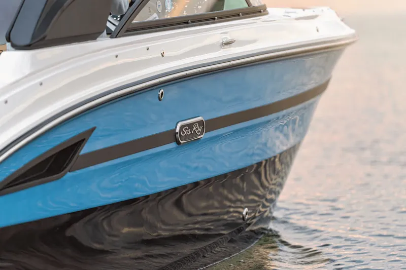 Slide: The Image of 2026 Sea Ray SDX 250 Surf boat on calm water. - 17
