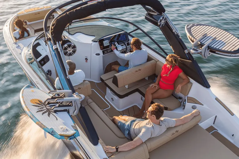 Slide: The Image of 2026 Sea Ray SDX 250 Surf boat with passengers on the water. - 18