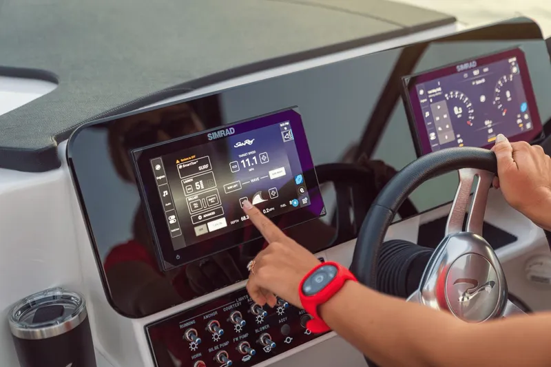 Slide: The Image of 2026 Sea Ray SDX 250 Surf dashboard with Simrad display. - 25