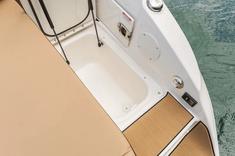 Slide: The Image of Interior of 2026 Sea Ray SDX 250 Surf with storage area. - 28