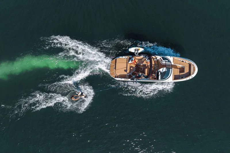 Slide: The Image of Aerial view of Sea Ray SDX 250 Surf boat engaged in watersports. - 7