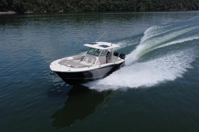 Slide: The Image of Electrical panel and battery compartment of 2021 Scout 330 LXF boat. - 19