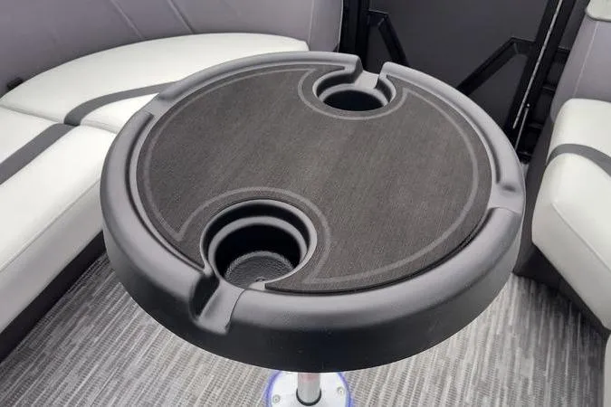 Slide: The Image of Round table with cup holders in Viaggio x22u, 2026 model boat interior. - 14