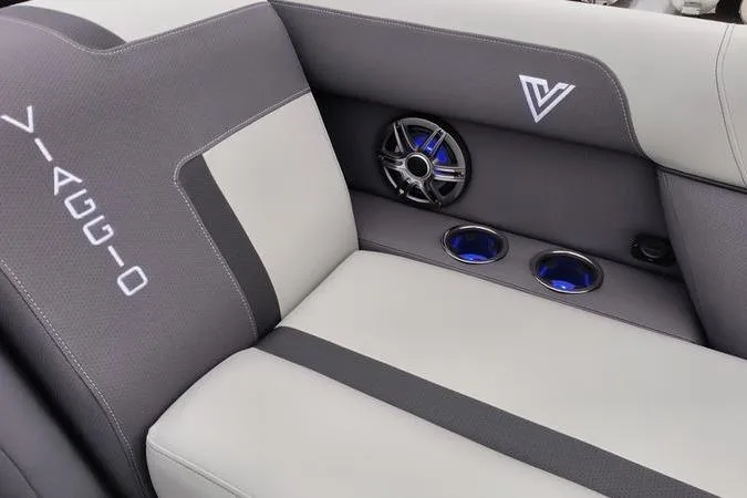 Slide: The Image of 2026 Viaggio x22u boat interior with branded seating, speaker, and cup holders. - 15
