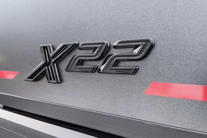 Slide: The Image of 2026 Viaggio x22u emblem on metallic surface with red accents. - 3