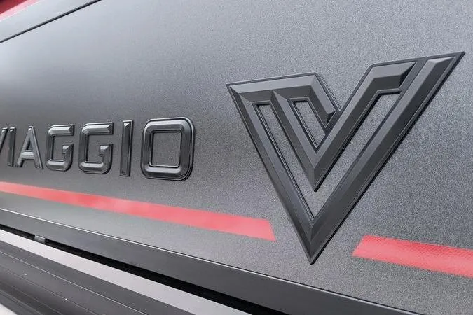 Slide: The Image of 2026 Viaggio x22u logo on sleek metallic surface with red accent stripe. - 4