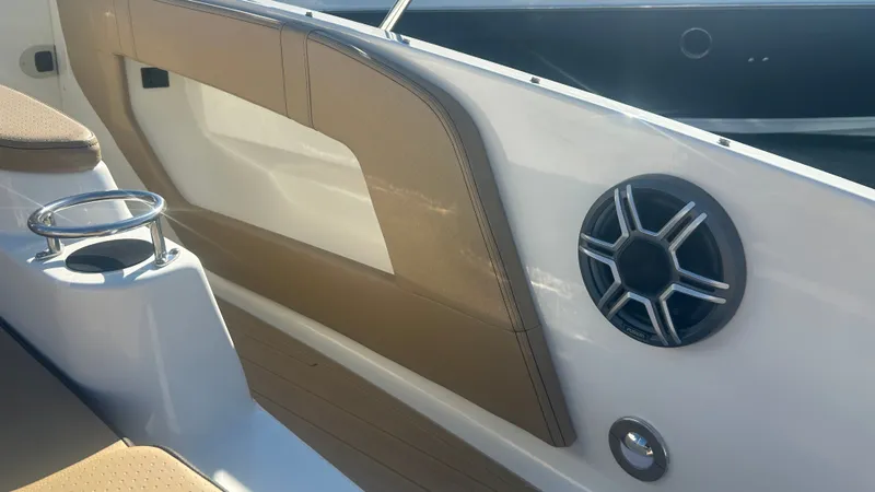 Slide: The Image of Close-up of a boat deck with speaker and cup holder. - 43