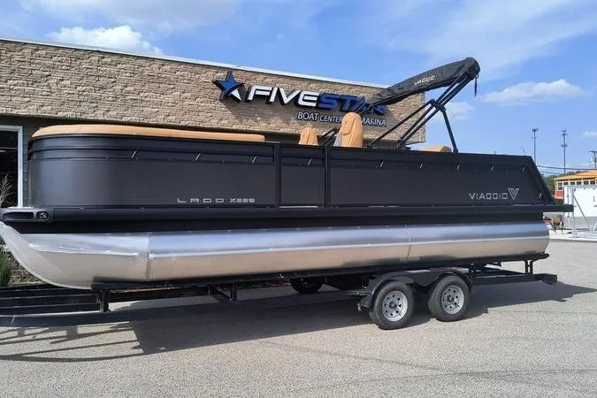 The Image of 2026 Viaggio X22S pontoon boat outside a boat center. - 0