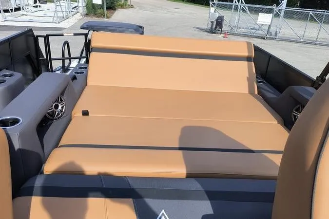 Slide: The Image of Viaggio X22S 2026 boat with beige lounge seating and speakers. - 14