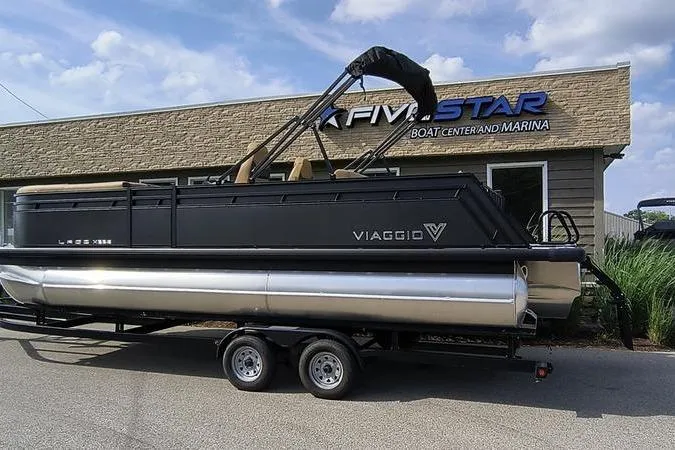 Slide: The Image of 2026 Viaggio X22S pontoon boat at a boat center. - 2