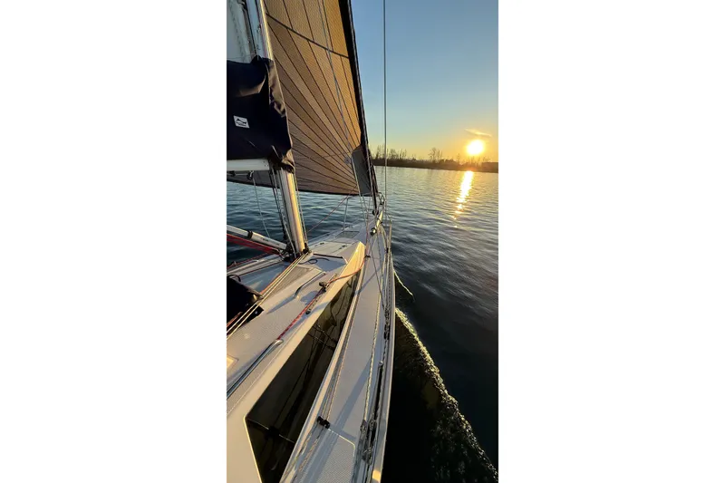 Slide: The Image of 2016 Catalina 275 Sport sailing at sunset on calm waters. - 17