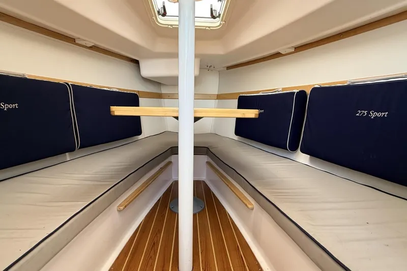 Slide: The Image of Interior of 2016 Catalina 275 Sport with blue cushions. - 3
