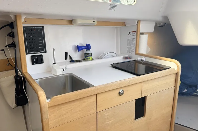 Slide: The Image of Interior of 2016 Catalina 275 Sport with kitchenette and sink. - 4