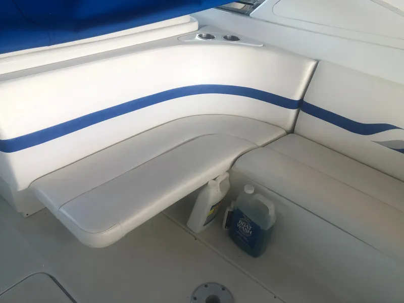 Slide: The Image of 2004 Formula 330 Sun Sport boat interior with white and blue seating. - 16