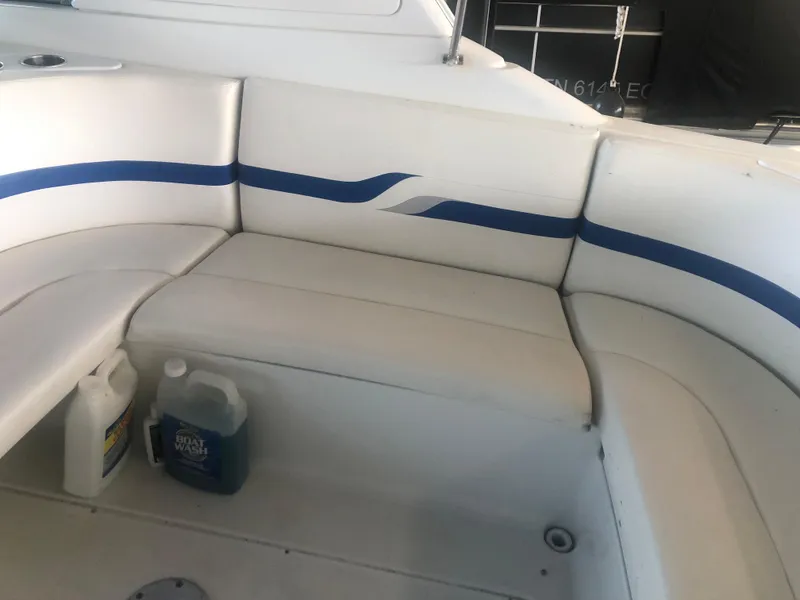 Slide: The Image of 2004 Formula 330 Sun Sport boat interior with white and blue seating. - 17