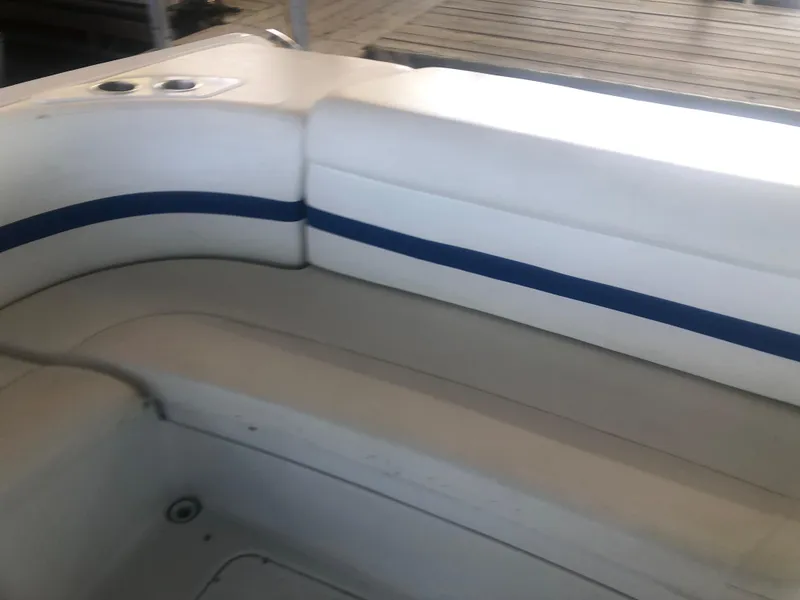 Slide: The Image of 2004 Formula 330 Sun Sport boat interior with white and blue seating. - 18