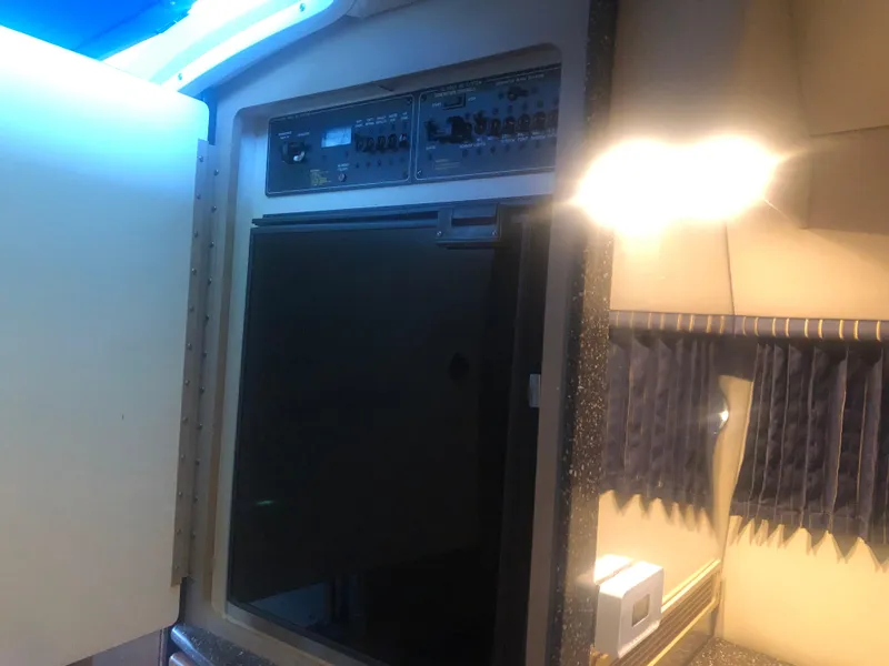 Slide: The Image of Interior of a 2004 Formula 330 Sun Sport boat with control panel and lighting. - 35