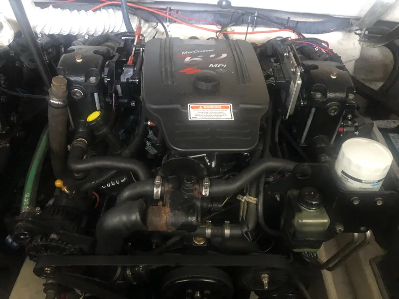 Slide: The Image of Engine of a 2004 Formula 330 Sun Sport boat, showcasing detailed components. - 38