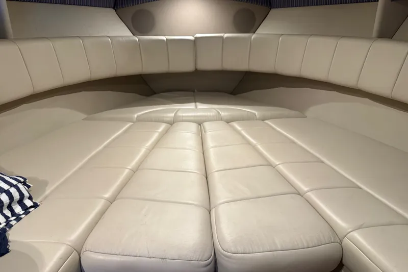 Slide: The Image of 2004 Formula 330 Sun Sport cabin interior with beige leather seating. - 48