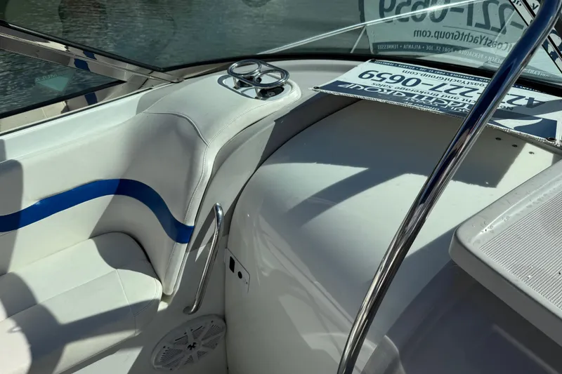 Slide: The Image of 2004 Formula 330 Sun Sport boat interior with white seating and blue accents. - 58