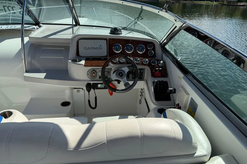 Slide: The Image of 2004 Formula 330 Sun Sport boat cockpit with Garmin navigation system and luxurious seating. - 69