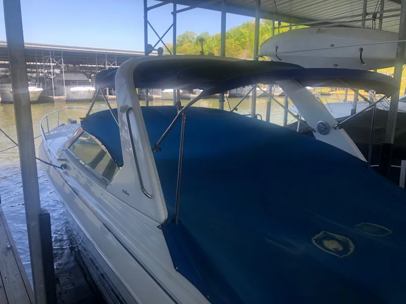 Slide: The Image of 2004 Formula 330 Sun Sport boat docked under a covered marina. - 7