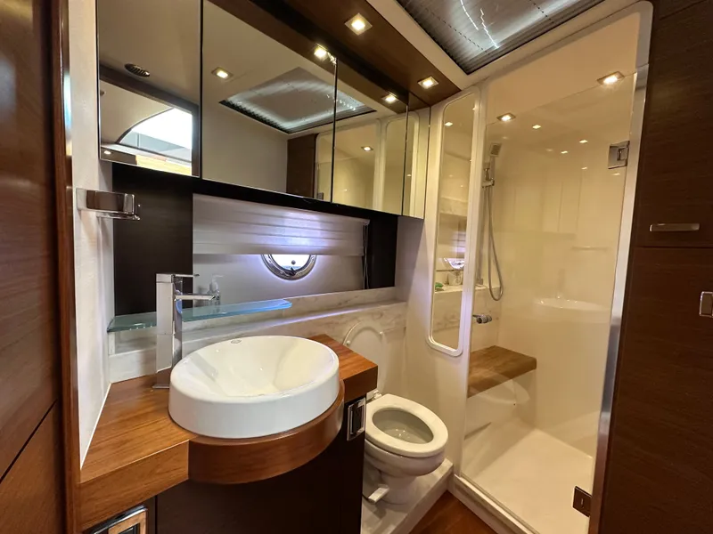 Slide: The Image of Luxurious bathroom in a 2015 Tiara Yachts 50 Sports Coupe. - 11