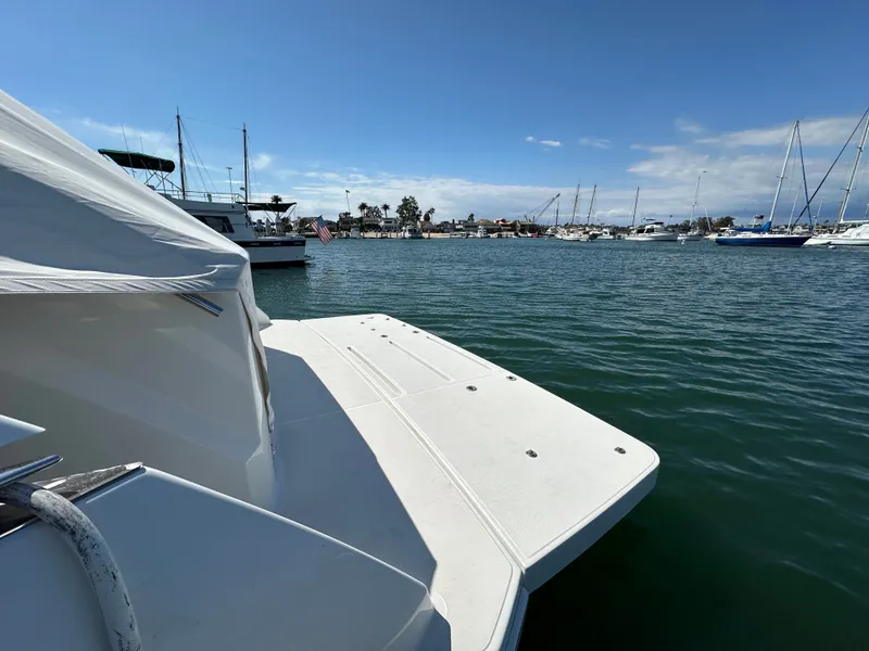 Slide: The Image of Tiara Yachts 50 Sports Coupe 2015 in harbor with blue sky. - 3