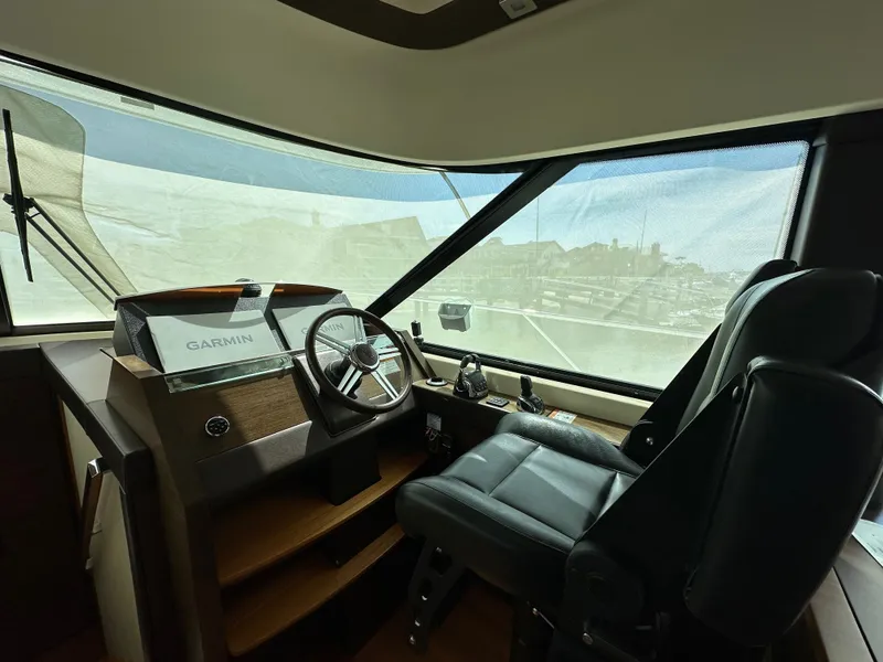 Slide: The Image of Interior view of 2015 Tiara Yachts 50 Sports Coupe helm. - 6