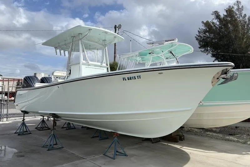 The Image of 2024 Stuart 27 boat on stands outdoors. - 1