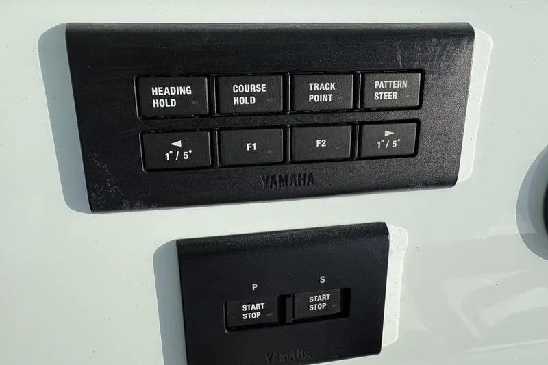 Slide: The Image of Yamaha control buttons on a Stuart 27 boat, model 2024. - 13