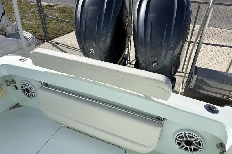 Slide: The Image of 2024 Stuart 27 boat with dual outboard engines and speakers. - 18