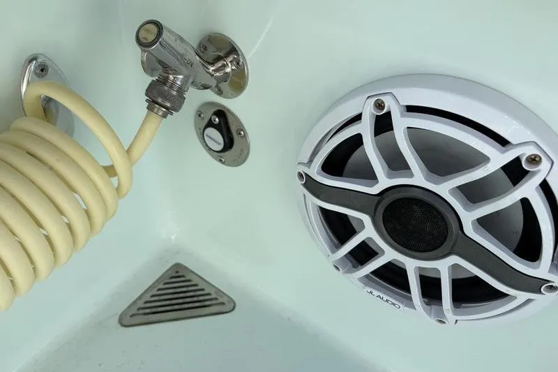 Slide: The Image of Stuart 27 boat 2024: speaker and shower head detail view. - 20