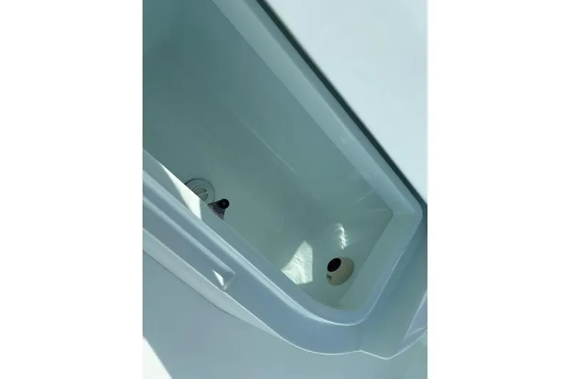 Slide: The Image of Interior view of a 2024 Stuart 27 boat with white hull. - 22