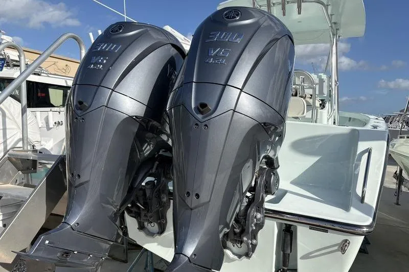 Slide: The Image of Two Yamaha 300 V6 outboard motors on a 2024 Stuart 27 boat. - 26