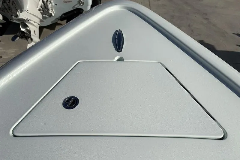 Slide: The Image of Bow of a 2024 Stuart 27 boat with storage compartment. - 5