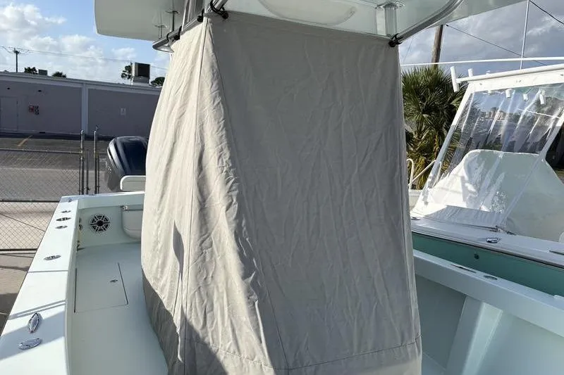 Slide: The Image of Stuart 27 boat 2024 with cover at dock. - 8